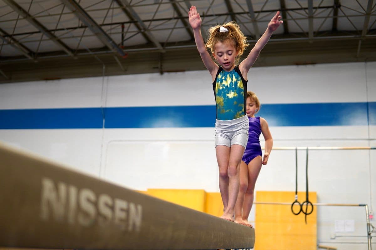A child learning aerial movement safely at Airborne